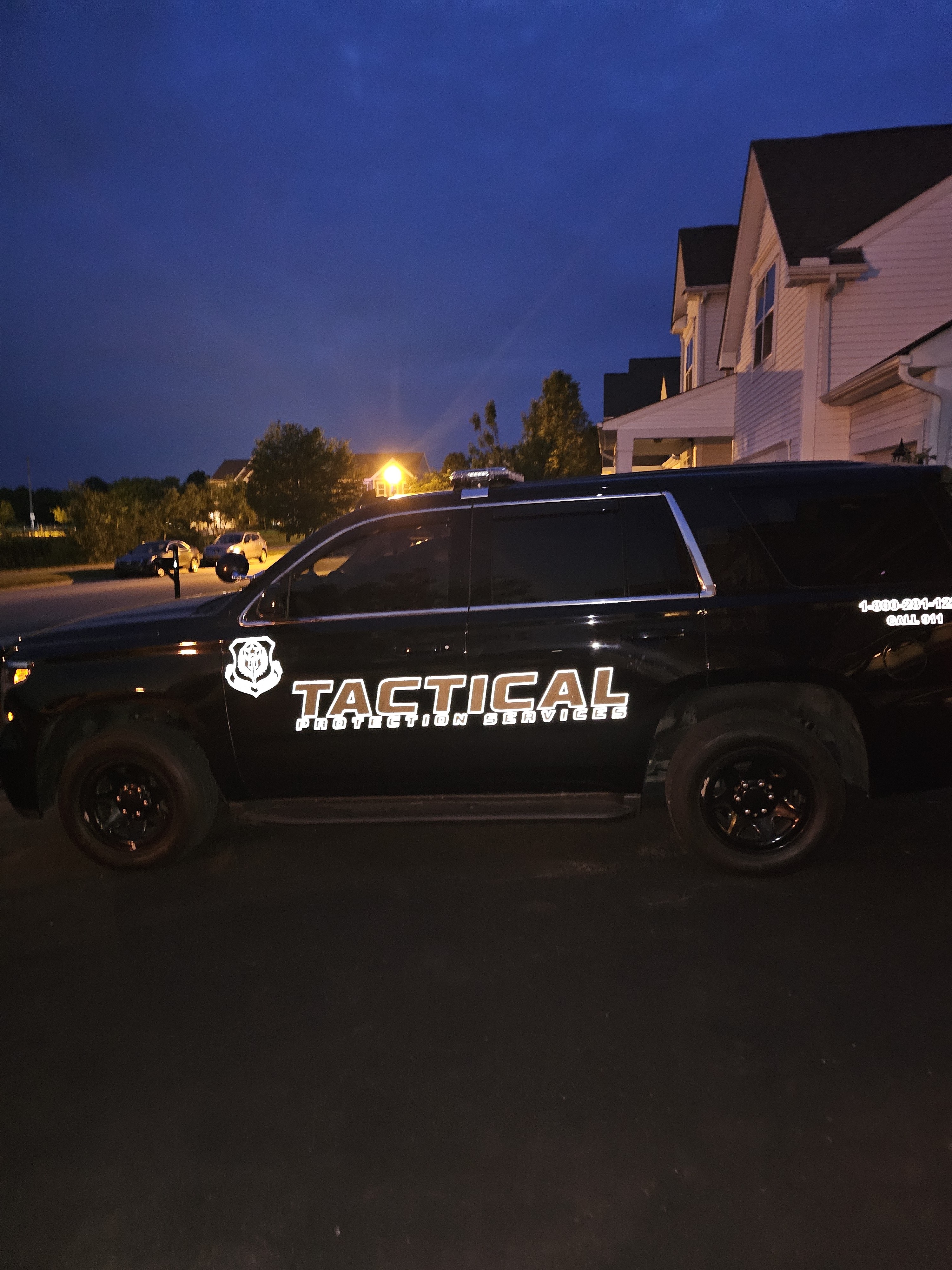 Tactical Protection Services marked patrol vehicle at dusk