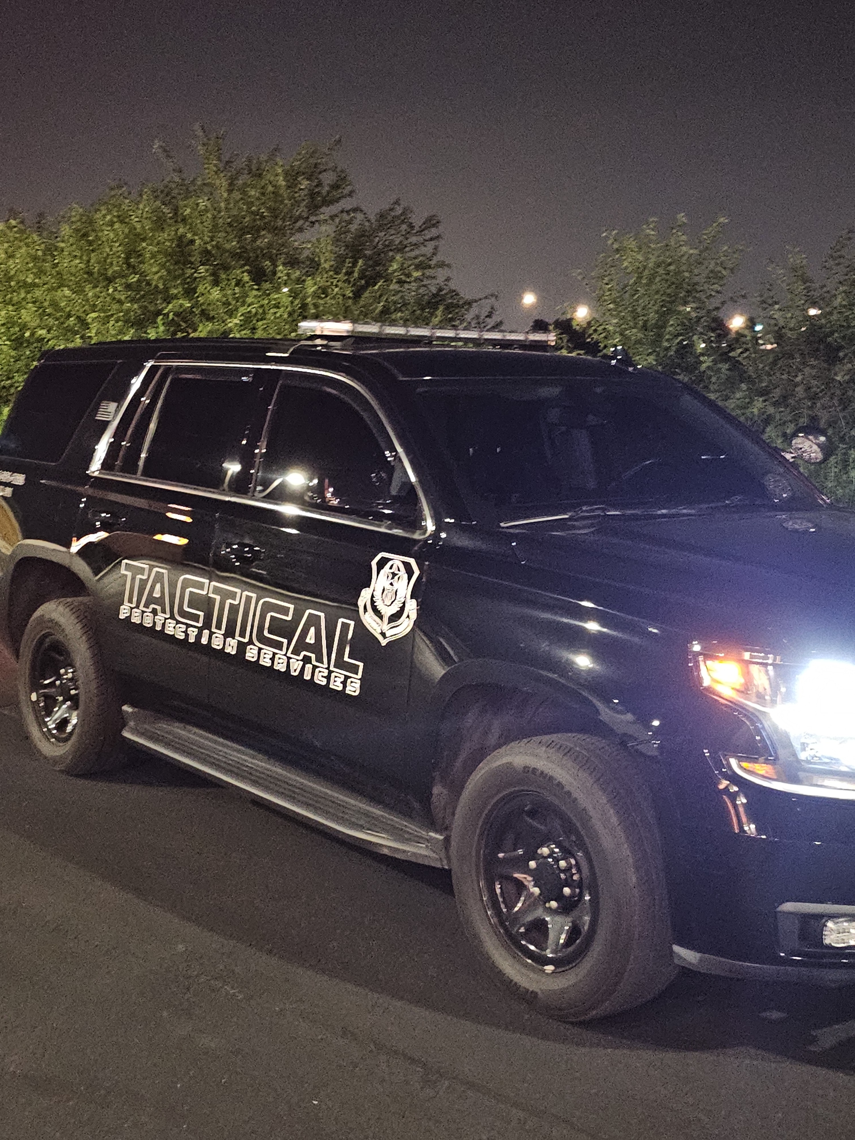 Tactical Protection Services marked patrol vehicle at night